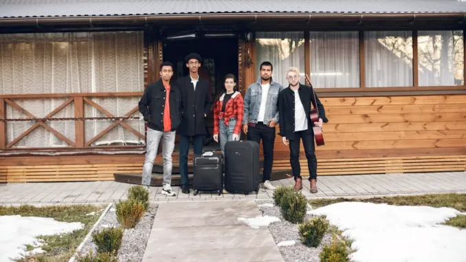 hipster-travellers-ready-trip-indian-men-woman-holding-suitcases-house_1157-47904