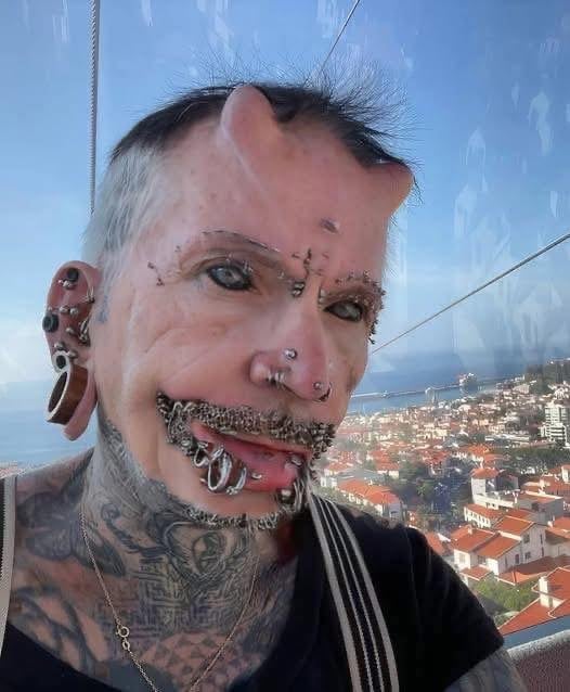 A man with 560 piercings, countless tattoos, and forehead implants – this is how he looked before